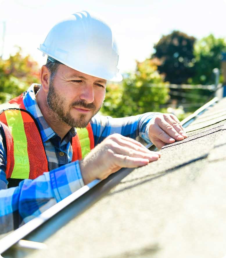 Roofing professional performing a roof inspection